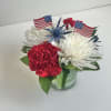 Red Carnations, White Mums and Blue Thistle Arranged in a Small Glass