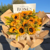 10 sunflowers beautifully arranged with orange alstroemeria flowers with touches of solidago