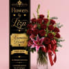 A lush cluster of deep red roses centered around a single large