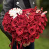 Heart-shaped bouquet of red roses with white orchids and butterfly picks