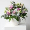 A soft spring lavenders and blues accented with pink and green flowers