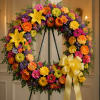 A vibrant circular sympathy wreath arranged to celebrate a life in full