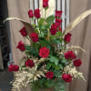 Honor your loved one with this strikingly beautiful tribute. Red roses are