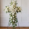 A serene white sympathy cross designed to honor a life with quiet