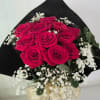 12 Roses in a designer embossed wrap with greenery and baby's breath