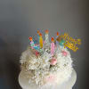 This adorable cake arrangement is sure to put a smile on any