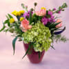 Overflowing with soft color and effortless charm, Garden Party Grace captures the