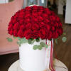Large dome of red roses in a white hat box with ribbon