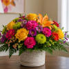 A lively, garden-style arrangement that instantly lifts the room - a cheerful
