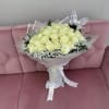 Bouquet of pale yellow roses with white baby's breath and butterfly picks