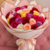 A lush, full dome of one hundred roses in a joyful palette