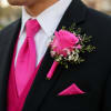A vivid hot pink rose takes center stage in this boutonniere, designed