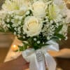 Creamy white roses take center stage in this white mixed flower nosegay