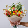 bouquet of 20 tulips with fillers and green foliage on a decorative