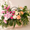 Inspired by Flora, the Roman goddess of flowers and spring, this arrangement