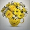 Sunshine in a mug - bright yellow roses and cheerful white-and-yellow daisies