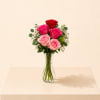 A sweet and romantic flower arrangement featuring a beautiful mix of blush