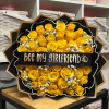 A vibrant cluster of fifty bright yellow roses arranged into a rounded