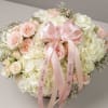 A timeless and elegant basket filled with fresh pink and white roses
