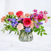 Bloom Flux is a bold, high-energy floral arrangement designed for movement, color