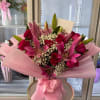 A lush, rounded bouquet that reads like an embrace in pink: hot
