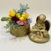 A compact cluster of sunlit yellow roses crowned by a petite gold