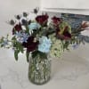 A unique collection of red, white and blue stems thoughtfully gathered to