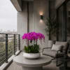 Potted arrangement of bright pink orchids in a white bowl planter