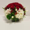 6X6 square vase with some beautiful red roses and a mix of