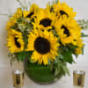 All sunflower arrangement in fishbowl vase 
It contains around 25 sunflowers with