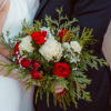 Winter Greens set the tone for this gorgeous red and white rose