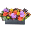 Mixed bouquet of orange roses and purple orchids in a black rectangular container