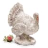 Decorative turkey figurine with a small pink rose accent