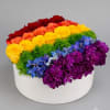 A bold, celebratory rainbow of roses-this mixed-color floral arrangement is perfect as