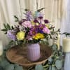 This birthday bouquet brings a playful mix of pinks, purples, sunny yellow