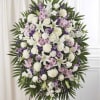 Soft white lilies and roses set against touches of lavender and pink