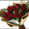 A tightly clustered bouquet of red roses framed by rounded eucalyptus leaves