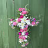 Celebrate a life beautifully lived with the Angelic Garden Cross, a graceful