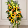 A mix of Bells of Ireland, mini sunflowers, lilies, roses, snap dragons