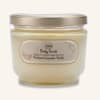 Jar of body scrub with a gold lid and beige label