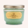 Jar of green body scrub with a gold lid
