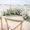 Half moon arch in pastel color flowers.