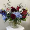 The most premium flowers in patriotic colors. Arranged in a vase that