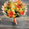&ldquo;A bright and cheerful bouquet featuring vibrant orange lilies, gerbera daisies, yellow