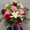 A classic glass vase filled with a beautiful mix of fresh flowers
