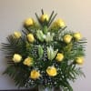 Beautiful front-facing paper matche base arrangement accompanied with greenery.