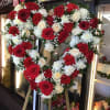 Beautiful sympathy heart spray made with roses and carnations.
