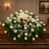 An array of peach roses sprinkled with baby's breath.