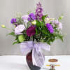 Celebrate the beauty of the season with this charming arrangement featuring a