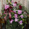 Large bouquet of pink and red roses with ribbon on a table